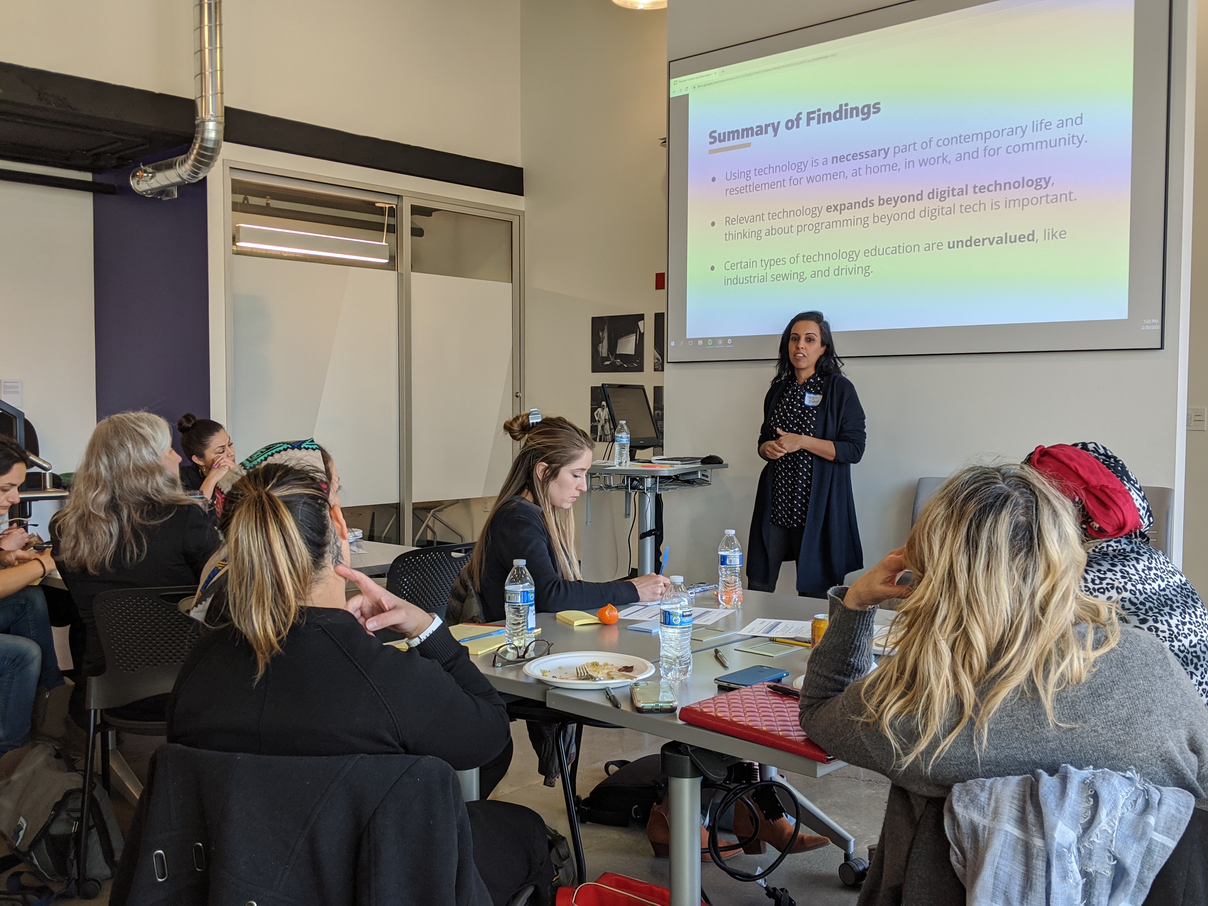 Woman presenting slides to a group