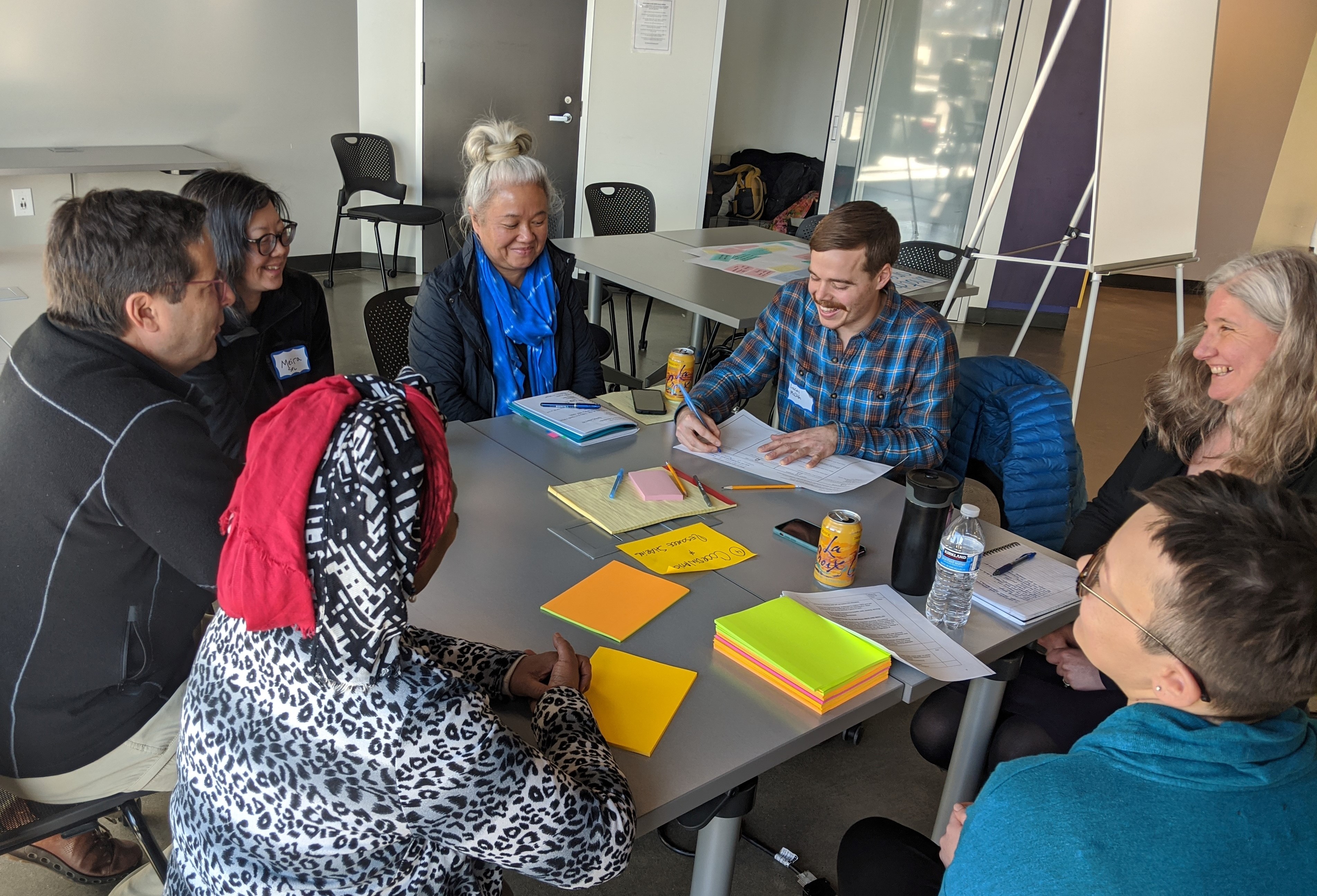 Smiling people working in a small group